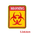 Yellow warning patch with red biohazard symbol and embroidery, size 5.2x6.6cm - Warning Biohazard Slogan Arched (PE8750CT)