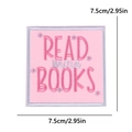 Macro shot of pink embroidered patch featuring Read More Books text and flowers - Read More Books Style (PE15448CT)