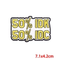 Embroidered 50% IDK 50% IDC rectangular patch with yellow lettering on white fabric - White Black Border 50% IDK 50% IDC (PE8729CT)