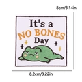 Cartoon frog embroidery patch with 'It's a NO BONES Day' text, 8.2cm x 8cm size - No Bones Frog Style (PE15764CT)