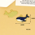 Macro view of whale charm details showing 26mm width and 14mm height measurements - Whale