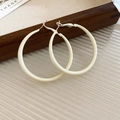 Detailed macro shot of elegant retro cream white C-shaped hoop earrings with silver needles. - C-Shaped Hoop Style (HE7406) / Cream White / Large 5cm