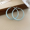 Detailed macro view of light blue enamel C-shaped hoop earrings with retro matte finish. - C-Shaped Hoop Style / Blue / Large 5cm