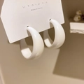 Elegant white C-shaped hoop earrings with a smooth glossy finish on a display card. - C-Shaped Hoop Style (22#) / White