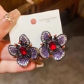 Close-up detail of vintage flower stud earrings with red, purple zircons on steel card. - No.7 Black Gunmetal Red Zirconia Style (WE5880) / Gunmetal - Purple