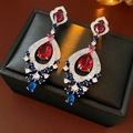 Close-up of vintage tassel earrings with colorful zircons on a black jewelry box. - No.10 Gorgeous Tassel Style / Silver-Blue-Pink