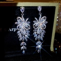 Detailed macro view of sparkling zircon tassel drop earrings with marquise-cut accents - No. 48 Silver Earring Post Style / Silver