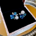 Elegant stud earrings featuring vibrant blue crystals and lustrous pearls in a gift box. - Style 4 / Blue