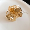 Detailed close-up of a textured gold 3D flower ring featuring a hammered metal finish - Flower Embossed Style (73#) / Gold