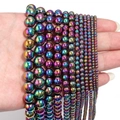 Macro view of iridescent hematite round beads in various sizes for DIY jewelry making - Approx 38cm Length, 3mm Diameter, 0.4mm Hole (Approx 130pcs) / Rainbow