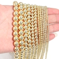 Detailed view of various sizes of golden hematite round beads for DIY jewelry making - 10mm (Approx 38pcs) / Gold