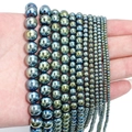 Detail of multi-size iridescent magnetic hematite beads with rainbow metallic finish - Approx 38cm Length, 3mm Diameter, 0.4mm Hole (Approx 130pcs) / Electroplated Green