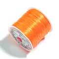 Bright orange strong and stretchy flat elastic beading thread on white spool - Orange