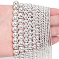 Detailed view of silver hematite beads in multiple sizes on hand for DIY jewelry making - 10mm (Approx 38pcs) / Silver