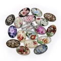 Vista detallada de cabujones de cristal ovalados con motivos florales y monumentos de París - Patrón de Forma de Flor Vintage (20x30mm) / Juego de 20 Piezas
