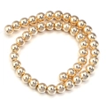 Polished golden hematite round beads on a transparent string for DIY jewelry making - 6mm / KC Gold