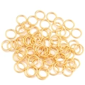 Anellini aperti placcati oro per creazione gioielli fai-da-te su sfondo bianco - Diametro Esterno 3mm (200 Pezzi/Confezione) / Oro