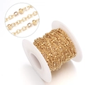 Macro shot of gold satellite chain with beaded details on a white plastic spool - Bead Chain / 2mm Width (3mm Bead) / Gold