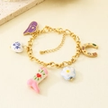 Detailed view of gold charm bracelet with colorful cowboy boots and hat pendants - Bracelet (KB210045-SXSJ)