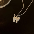 Close-up of an elegant mother-of-pearl cat pendant necklace shown on a dark textured surface - 1# Necklace (HN11638) / Silver
