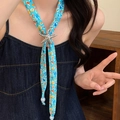 Close-up of a starfish pendant necklace with a blue ocean-themed printed fabric strap on a model - 8# Necklace-Blue-Silver