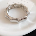 Macro view of stylish silver wide bangle featuring realistic bamboo joint texture detail - Bamboo Section Shape (81#) / Silver