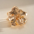 Close-up detail showing the hammered texture of a gold metallic wrinkled flower ring - Bangle / Gold