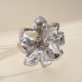 Detailed close-up of a silver metallic crumpled flower ring with hammered texture - Ring / Silver