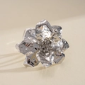 Detail of a metallic hammered flower ring featuring exquisite crinkled petal texture. - Bangle / Silver