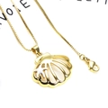 Detailed close-up of shell pendant necklace with zircon and starfish on a box chain - Necklace Set / White Starfish Gold Shell