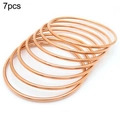 Set aus 7 minimalistischen roségoldfarbenen 2mm dünnen Stapelarmreifen - 7er-Pack Set / Roségold / Innendurchmesser 55mm