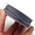 Detail of silver braided dragon cord roll for DIY jewelry making and bracelets - Approx. 1.5MM / Grey Style
