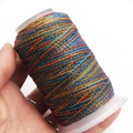 Macro shot of 6-strand multi-color dyed waxed thread on white spool for DIY jewelry - 6-Strand / C328 (Red Blue Yellow Green)