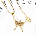 Macro shot of gold butterfly pendant with white enamel and micro-paved cubic zirconia - White Enamel Butterfly Necklace (45cm)