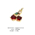 Macro view of gold copper cherry pendant with red zircon stones and green leaf detail - Deep Red Zirconia Cherry (28#)