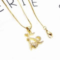 Macro shot of gold plated box chain necklace with zircon paved letter pendant and clasp - Necklace (Includes Box Chain) / Artistic Font Fe Heart Necklace
