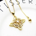 Detail of Celtic knot necklace with heart-shaped zircon on a white ceramic tray - Heart Celtic Knot Necklace Set (3)