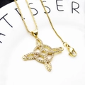 Macro detail of gold Celtic knot pendant with micro-paved zircons on a sturdy box chain - Woven Style Necklace Set (5)