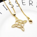 Close-up of gold plated Celtic knot pendant with cubic zirconia on a box chain - Geometric Interwoven Necklace Set (6)
