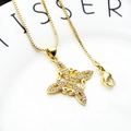 Close-up of golden Celtic knot pendant with sparkling cubic zirconia on box chain - Spiral Vintage Knot Necklace Set (7)