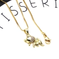 Macro view of gold-plated goldfish pendant with micro-pave cubic zirconia on box chain - Goldfish Necklace