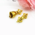 Golden Buddhist Vajra and Ghanta bell charms on white background with floral accents - Style A Set