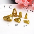 Detailed macro of vintage gold-plated trumpet flower bead caps in three varied sizes - Hollow Trumpet Style / 5.5x9.5mm