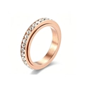Detailed macro view of a rose gold spinner ring featuring a single row of sparkling clear crystals - 7 / Round Style / Rose Gold