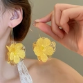 Detailed view of elegant yellow mesh flower earrings with long gold hooks on model - Large Chiffon Material Flower Earring Hook (17# Earring Hook - Yellow)