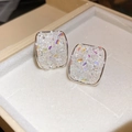 Close-up of square silver stud earrings featuring shimmering iridescent crushed crystals. - No.69 Iridescent Crushed Ice Texture Square Style / Silver