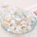 Iridescent white acrylic beads in shell tray including stars hearts and bubbles - White