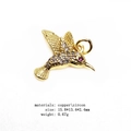 Detailed view of hummingbird pendant with white zircon micro-pave and a red eye accent - Branch-Holding Hummingbird (15#)
