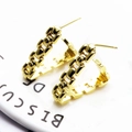 Macro view of gold C-shaped chain link earrings with polished finish on white surface - Chain Style (2)