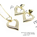 Close-up of 14K gold plated heart necklace and earrings set with sparkling zircon stones - Large Hollow Heart Pendant Jewelry Set (Set 8)